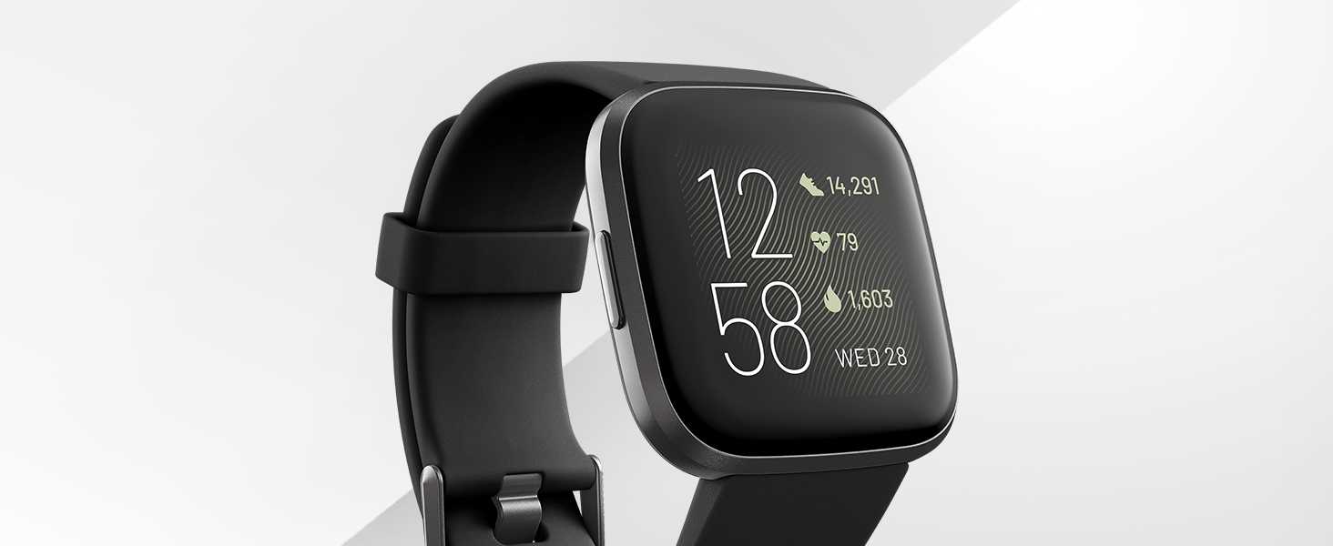 fitbit Versa 2 watch with black wristband and clock displayed